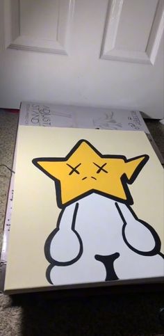 a canvas with a yellow star on it