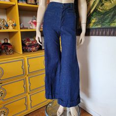 Land Lubber    Vintage 70s landlubber jeans in a dark blue wash. High waisted with a snap and zipper to close. 2 small front pockets with no back pockets. Fitted to the knees where they start to flare into huge bellbottoms which are cuffed. No size tags but they seem to be an XS/S but please check below for best fit.                                Bust n/a  Waist 26''  Hips 36''  Length 39''  Inseam 30''  Rise 11''  Landlubber patch on back is worn away (see photo) Vintage 70s Clothes, Jeans Bell Bottoms, Hippie Jeans, 70s Clothes, Seventies Fashion, Random Clothes, High Waist Denim, Chattanooga Tn, Womens Jeans