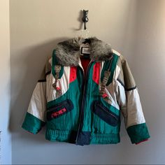 The Ultimate Vintage Ski Coat! Vintage Neiman Marcus, Very Warm Down Jacket. Mix Of Duck Down And Waterfowl Feather. Red, Green And Tan. Removable Faux Fur Collar. Size Men’s Xs Or Oversized Women’s Small. Excellent Condition, No Flaws. Laying Flat, Approximate Measurements As Follows Pit To Pit 25in Top Of Fur Collar To Bottom Hem 30in Sleeve From Pit To Cuff 18in Ski Coat, Warm Down, Coat Vintage, Vintage Ski, Faux Fur Collar, Duck Down, Ski Jacket, Fur Collar, Fur Collars