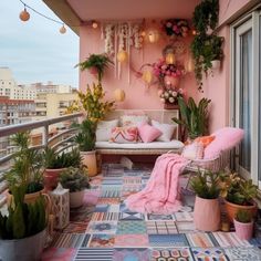 a balcony decorated with potted plants and hanging decorations on the wall, along with a couch