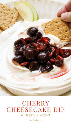 a plate with crackers and cherries on it