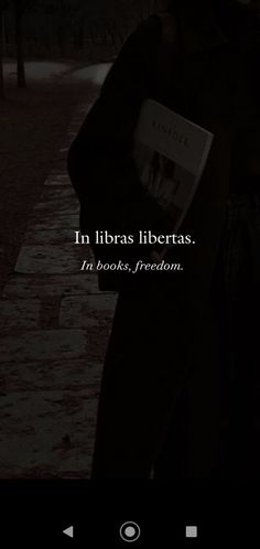 an image of a person walking in the dark with a book on their lap and text that reads in libras liberas