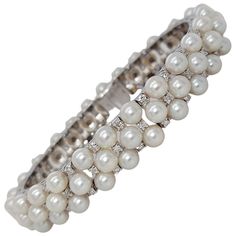 Stunning 18 kt White Gold Pearl and Diamond Bracelet Diamonds: 75, Total 1.5 Ct Pearls: 75 (size 4.5mm) Material: 18kt white gold Total weight: 47.8 gram / 1.690 oz / 30.8 dwt Measurements: Will max fit a 17 cm wrist Pearl And Diamond Bracelet, Pink Gold Bracelet, White Gold Diamond Bracelet, Designers Jewelry Collection, Expensive Jewelry Luxury, Lace Bracelet, Modern Bracelets, Antique Modern, Antique Bracelets