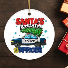 santa's favorite police officer ornament with christmas tree on the car and presents