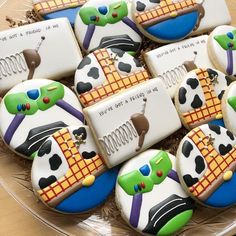 decorated cookies in the shape of pandas on a platter with writing and pictures