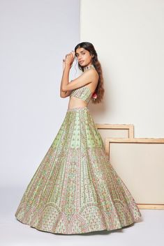 Silk based multi-hued thread embroidered lehenga paired with matching halter blouse and tulle dupattaFrom Chamee and Palak's A Hundred Flowers collection DELIVERY TIMEPlease wait 8-12 weeks for your outfit to arrive. FABRIC DETAILSDupion Silk, Tulle Professional cleaning only. Festive Fusion Sets With Resham Embroidery, Festive Fusion Reception Sets, Fusion Style Festive Sets With Resham Embroidery, Fusion Style Festive Wedding Sets, Festive Fusion Lehenga For Wedding, Fusion Wedding Sets With Resham Embroidery, Fusion Style Wedding Sets For Festive Occasion, Festive Fusion Wedding Sets, Festive Fusion Lehenga With Zari Work