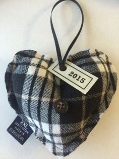 a black and white plaid heart ornament hanging on a wall