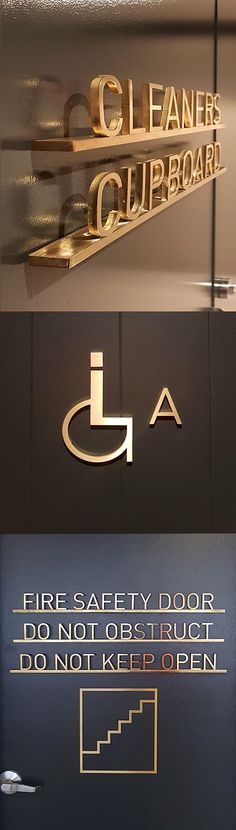 three different types of metal and glass logos on the side of a building with gold lettering