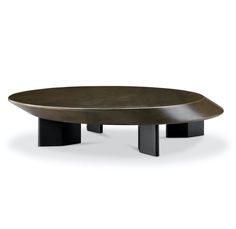 an oval coffee table with two black legs