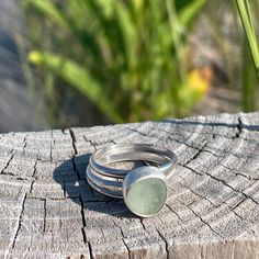 Foam Green Sea Glass was found in Hawaii. 925 Sterling silver and fine silver was use to create this handmade ring. The stacking bands are beaded and twisted sterling silver. The main ring band is hammered half round wire. This collection includes three separate rings. Size 7.75 Photos are taken outside in sunlight and shaded areas to show the way the light shines differently on the sea glass and pottery. Adjustable Stacked Silver Rings, Adjustable Hand Wrapped Sterling Silver Rings, Silver Adjustable Hand Forged Stackable Rings, Silver Hand Wrapped Ring, Adjustable Silver Stackable Hand-forged Rings, Adjustable Hand Wrapped Silver Rings, Adjustable Silver Rings Hand Wrapped, Adjustable Hand Forged Silver Stackable Rings, Adjustable Hand-forged Silver Stackable Rings