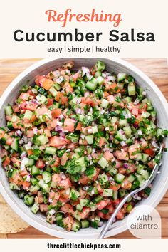 a white bowl filled with cucumber salsa next to tortilla chips