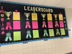 a bulletin board with ribbons and awards on it's side in a classroom setting