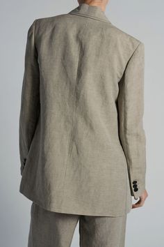 THIS ITEM IS FINAL SALE The Kara Jacket in Grey Linen offers effortless and easy style with its soft tailored design, accented by a double button front and black top stitch. Cut in a long line, this blazer is perfect for any occasion. Made with high-quality linen for a comfortable and polished look. Soft Tailoring, Tuxedo Pants, Easy Style, Tailored Design, New Pant, Outerwear Vest, Blazer Vest, Gray Linen, Knitwear Tops