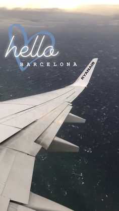 an airplane wing with the words hello barcelona on it's side above the ocean