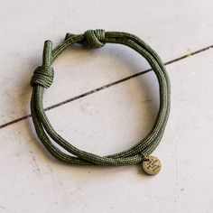 Introducing our resilient "So Do Not Fear Olive Paracord Bracelet," a symbol of courage and faith designed to accompany you on life's adventures. This bracelet is crafted with durable olive green paracord, known for its strength and versatility, ensuring reliability in any situation.The centerpiece of this bracelet is a distinctive bronze charm inscribed with the empowering message "So Do Not Fear" and "For I am with you Isaiah 41:10" on the back. This timeless phrase serves as a reminder to tru Durable Nylon Cord Bracelets For Outdoor, Adjustable Nylon Cord Braided Bracelets For Outdoor, Adjustable Green Bracelets For Outdoor, Outdoor Adjustable Braided Bracelets With Sliding Knot, Adjustable Braided Bracelets With Sliding Knot For Outdoor, Adjustable Braided Bracelet With Sliding Knot For Outdoor, Hiker Trailer, Not Bracelet, Printable Wrapping Paper