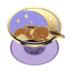 a purple and gold phone holder with a cartoon rabbit on the front, sitting on top of a purple disc