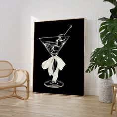 a black and white photo of a martini glass