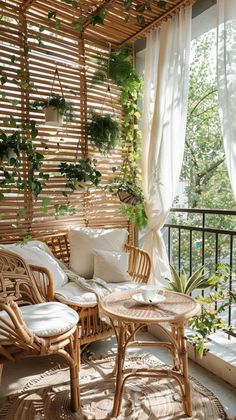 a balcony with wicker furniture and plants on the windowsill, along with white curtains