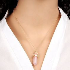 The symbol of love and the stone of hearty feelings - Rose Quartz Crystal There are endless reasons to have such a positive gemstone in your life. And, when it comes in the form of unique rose quartz necklaces, you just can’t miss having it. Prepared with love and care to support your values, this healing rose quartz necklace meaning revolves around emotional support, lovely energy, and blissful compassion. What you’ll get: Beautiful design: The rose quartz stone necklace contains a crown on top Rose Quartz Pendant Necklace, Rose Quartz Necklace Pendants, Quartz Pendant Necklace, Unique Roses, Trending Necklaces, Pink Rose Quartz, Quartz Crystal Necklace, Rose Quartz Pendant, Rose Quartz Necklace