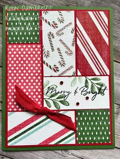 a close up of a christmas card with red and green stripes, holly leaves, and candy canes