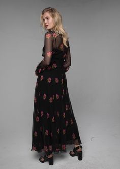 Dating to the late 70's, this Jean Louis Scherrer haute couture dress is numbered and features a black sheer chiffon overlay with a shocking pink floral print floating over a structured opaque black underlay with a nipped in waist, ruffled sleeves and a full floaty skirt. Feminine, romantic & tailored to perfection, this is a wearable and collectible piece of 70's Parisian couture. Marked size: none Best for: XS/S Measurements (laid flat and fastened): shoulder to shoulder: 13″/33cm, bust: 1 Fitted Bodice Dress, Jean Louis Scherrer, 70s Jeans, Feminine Romantic, Shocking Pink, Haute Couture Dresses, Couture Dress, Bodice Dress, Chiffon Overlay