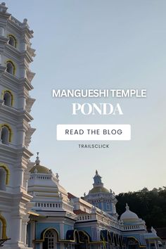 a tall white tower with yellow and blue trim in front of the words, mangushi temple ponda read the blog