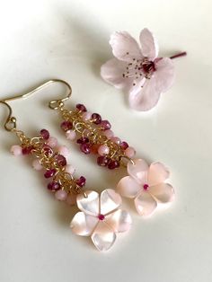 "Petite, lightweight earrings in 14K gold-fill, measuring only 2\" long, these are nevertheless stunners with clusters of tiny rondelles of pink opal and pink tourmaline, culminating with these mother of pearl cherry blossoms. Your jewelry will come gift-boxed, and gift-wrapping is available upon request.  Thank you for checking out my shop!" Pink 14k Gold-filled Dangle Jewelry, Handmade Pink 14k Gold-filled Earrings, Handmade Pink 14k Gold Filled Earrings, Pink Wire Wrapped 14k Gold-filled Jewelry, Pink Briolette Earrings For Wedding, Pink 14k Gold-filled Wire Wrapped Earrings, Pink 14k Gold Filled Drop Earrings, Pink Dainty 14k Gold Filled Earrings, Pink 14k Gold Filled Jewelry For Wedding