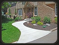 a house with landscaping in the front yard