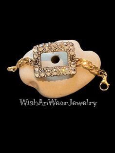 An Art Deco antique-silver tone rhinestone shoe buckle with very sparkly rhinestones is the focal on this one-of-a-kind, unique Boho style bracelet. The old chain gold tone shiny, textured curb chain originates from a vintage necklace. The weighty focal measures approximately 2-1/4"x1.5". The length is 7", finished with a solid brass lobster clasp. The length can be adjusted, if requested. You will want to wear this bracelet to be close to your actual wrist size. All stones are intact and appear original.  WishAnWear this unique bracelet soon, before She does!  Your bracelet will arrive nicely wrapped for you or for gift 🎁 giving.  The package will be mailed via USPS, first class with a delivery confirmation. Please visit my second Etsy shop MarveltyVintage, full of vintage jewelry and tr Adjustable Metal Jewelry With Rhinestones, Antique Adjustable Jeweled Jewelry, Bohemian Gold Bling Jewelry, Silver Metal Bracelet With Stone Setting, Bohemian Rhinestone Jewelry For Gifts, Vintage Adjustable Jewelry For Accessorizing, Adjustable Vintage Jewelry For Accessorizing, Antique Gold Jewelry With Rhinestones, Bohemian Silver Bracelets With Rhinestones