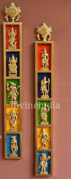 the wall is decorated with different colors and gold sculptures on it's sides, along with other decorative items