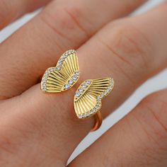 This beautifully designed Butterfly Ring makes a sweet statement. It is still very delicate and feminine. Adjustable design makes it possible to be worn on different fingers, so its super versatile! Made of 925 Sterling Silver THICK plating of 14k Gold or Rhodium Nickel-free & Hypoallergenic Ring Height: 14.7mm Adjustable ring sizes 7-9 Made of highest quality cubic zirconia for an authentic diamond look Butterfly Ring, Demi Fine Jewelry, Cleaning Jewelry, Chains Jewelry, Adjustable Rings, 925 Sterling Silver Ring, Sterling Silver Rings, Silver Gold, Ring Size