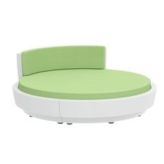 a green and white circular bed sitting on top of a table