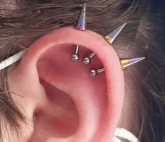 a person with some piercings on their ear