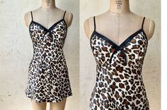 Vintage Leopard Satin Slip - Cool Leopard Print - Cute Bow Front & Lace Back Design Details - Bias Cut - 100% Polyester Satin Fabric - Made in Pakistan Measures:  Chest: 34" Waist: 29" Hip: 37" Length, HPS to hem: 27" (adjusts at straps) Retro Fitted Sleepwear For Loungewear, Fitted Retro Sleepwear For Loungewear, Fitted Vintage V-neck Nightgown, Vintage Fitted Nightgown For Party, Summer Fitted Mini Length Nightgown, Fitted Summer Nightgown For Pajama Party, Fitted Mini Nightgown For Summer, Fitted Mini Length Summer Nightgown, Retro Bedtime Dresses For Summer