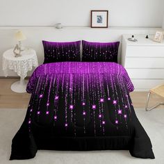 a purple and black bed with stars on it