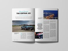 an open magazine with the image of a car driving down the road in front of it