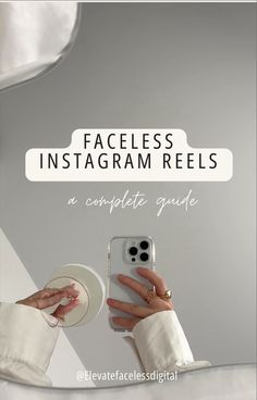 a person holding a cell phone with the text faceless instagram reels an complete guide