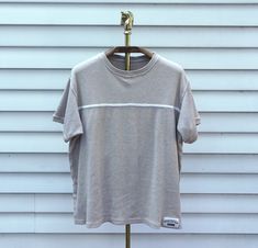 "- Trendy aesthetic vintage late 1990s basic midweight ribbed cream beige casual tshirt with classic white mid chest trim detail by Forenza - No tag, material unknown, but likely 100% cotton or cotton blend - Size unknown, likely XL, refer to measurements - 50\" bust | 25.5\" long | 7\" sleeve high school, 90's, skater, mom, momcore, basic, neutral, casual, cute, zoomer, gen x, gen z, millennial, coastal, beach, beachy, midwest, emo, indie, grunge, knit, 90s, fall, autumn" White Ribbed Tops For Streetwear, Ribbed Cotton T-shirt For Streetwear, Casual Ribbed T-shirt For Streetwear, Retro White Ribbed Top, White Retro Ribbed Tops, White Ribbed Retro Top, Vintage Ribbed Crew Neck Tops, Ribbed Crew Neck T-shirt For Streetwear, Vintage Ribbed Cotton Tops