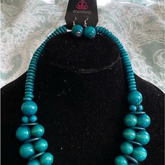 Teal Wooden Beaded Necklace With Complimentary Earrings. Casual Turquoise Jewelry With Wooden Beads, Blue Wooden Beads Round Jewelry, Blue Wooden Beaded Round Jewelry, Blue Wooden Round Beads Jewelry, Blue Adjustable Necklace, Blue Round Bead Necklaces, Blue Round Bead Necklaces As Fashion Accessory, Blue Necklaces With Round Beads As Fashion Accessory, Blue Necklace With Round Beads As Fashion Accessory