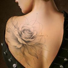 a woman with a rose tattoo on her back