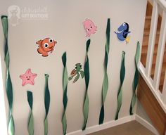 an under the sea scene with fish, starfish and octopus stickers on wall