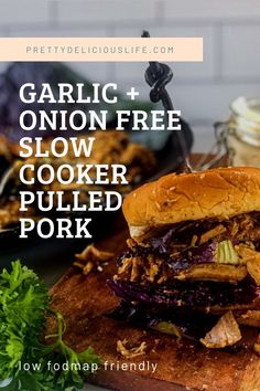 slow cooker low - fodmap pulled pork sandwich on a cutting board