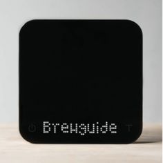 a black electronic device with the word breuude written on it's side