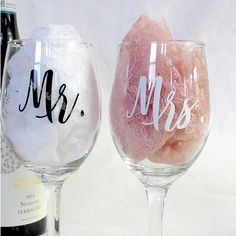 two wine glasses with the word mr and mrs painted on them next to each other