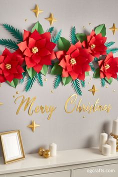 a christmas card with poinsettis and stars on the wall next to a dresser