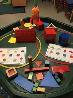 a child's play table with toys on it in a school room or classroom