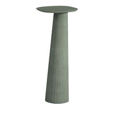 a tall green pedestal with a white background