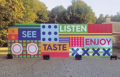 there is a large sign that says listen to taste enjoy