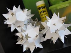 some white paper stars sitting on top of a table