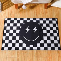 a black and white checkered rug with a lightning bolt in the center on a wooden floor